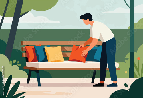 A person arranging colorful cushions on a wooden bench in a park-like setting, sunny day