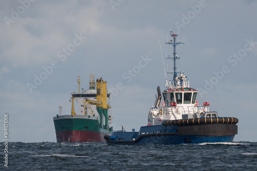 MARITIME TRANSPORT - Tugboat and freighter on teh seaway