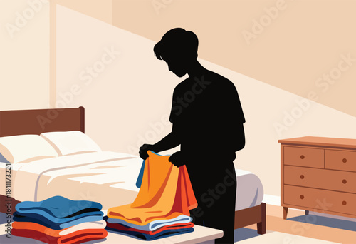 Silhouette of a person folding clothes, stacks of textiles and bedroom furniture featured