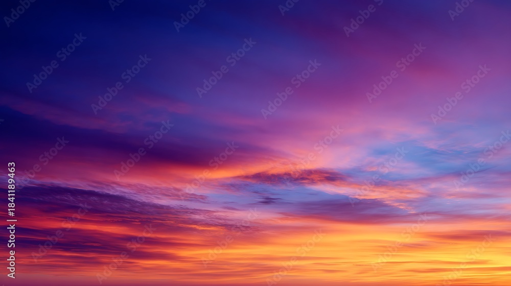 Fototapeta premium Dramatic Sky with Vivid Pink, Orange, and Purple Clouds at Sunset
