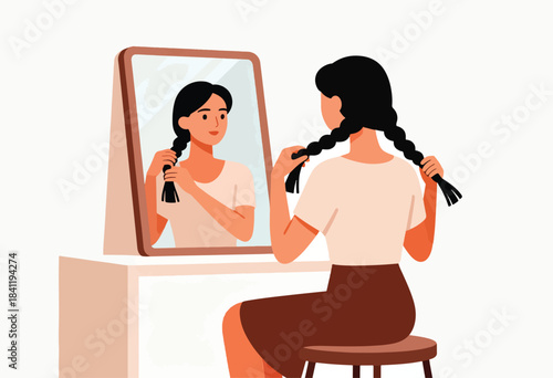 A woman braids her black hair in front of a mirror, seated on a stool. She's dressed in neutral tones