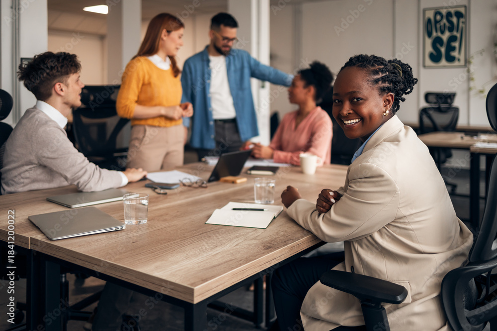 Fototapeta premium Diverse Team Collaborating in a Modern Office Environment