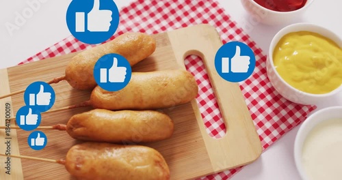 Blue thumbsup icon appearing left, spawning more icons floating over corn dogs showing rising likes