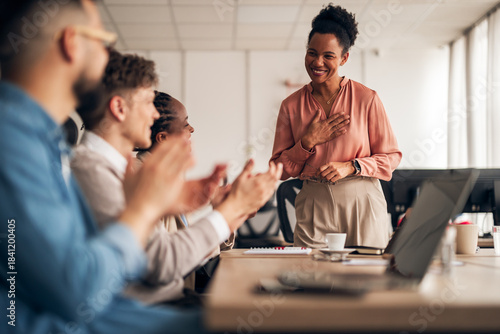 Professional Team Shares Gratitude and Celebrates Achievement in Office Setting