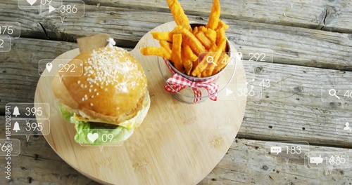 Left overlays appearing and drifting over still burger and fries as camera panning right for promo