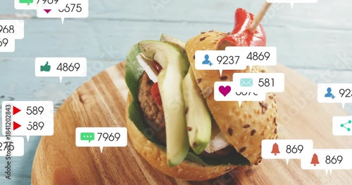 Notification badges entering from sides and clustering across seeded sandwich, showing social buzz