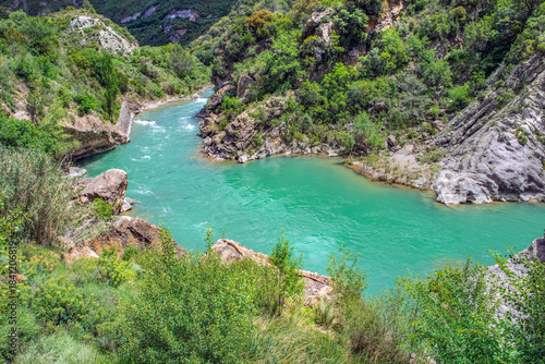 scenic view on blue turquoise water of Gallego river flowing in beautiful valley in Murino ee Gallego in Spain