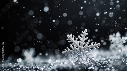 Silver hanging snowflakes border on black background. Winter holiday decoration with copy space for text