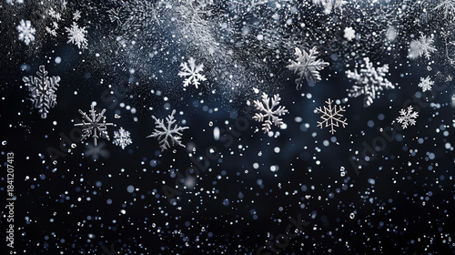 Silver hanging snowflakes border on black background. Winter holiday decoration with copy space for text