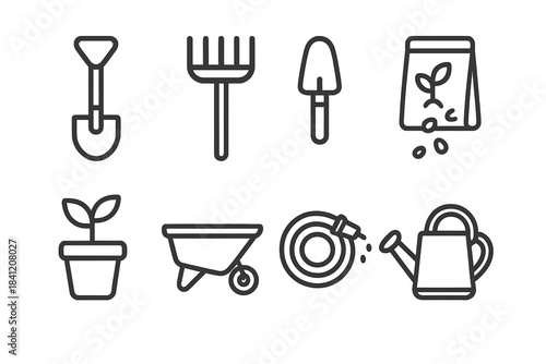 Gardening tools on a simple background showcasing various items used for planting and caring for plants in a garden