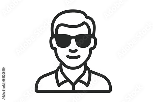 Person wearing sunglasses smiles while standing in a casual pose against a light background during daytime