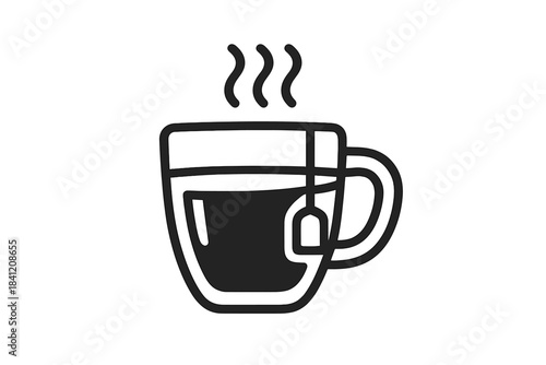 Hot cup of tea with tea bag on a kitchen table in the morning sunlight during a quiet breakfast routine