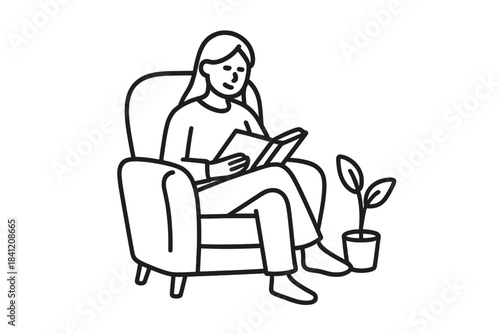 Person sitting in chair reading book near plant in living room during daytime