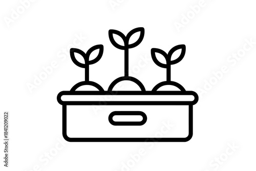 Growing plants in a container with soil and young sprouts during daytime in a garden setting