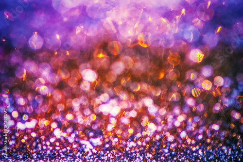 A vibrant, festive bokeh texture with bright, colorful out-of-focus lights creating a merry and dynamic background.