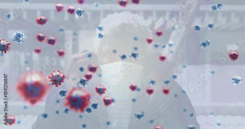 Man adjusting mask on porch as drifting virus particles approaching, causing protection for health