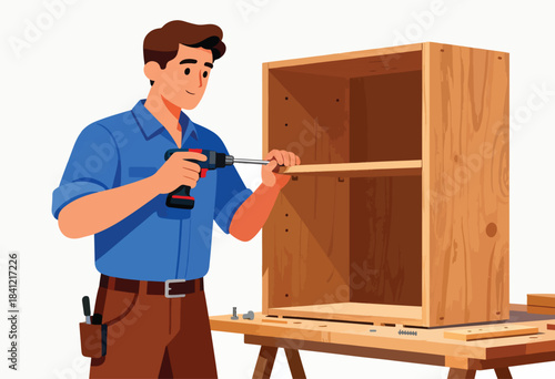 A carpenter uses a power drill to assemble a wooden cabinet. Tools and materials are on a workbench