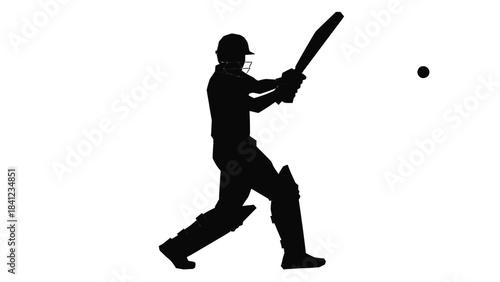 Silhouette of a cricket batsman in action preparing to hit the ball