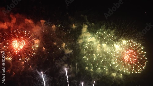 Amazing real beautiful colorful fireworks background on celebration night event for happy new year party, Abstract Multi color golden firework in the night sky