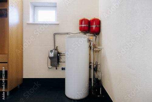 complete residence water heating and pressure regulation system with accessible utility installation