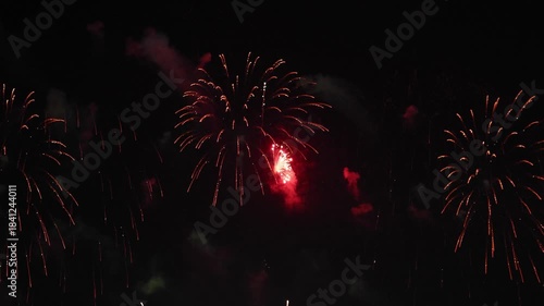 Amazing real beautiful colorful fireworks background on celebration night event for happy new year party, Abstract Multi color golden firework in the night sky