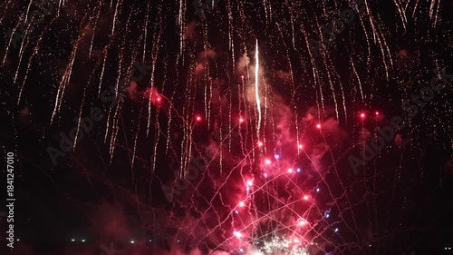 Amazing real beautiful colorful fireworks background on celebration night event for happy new year party, Abstract Multi color golden firework in the night sky