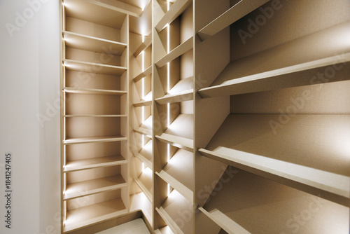 фотографія narrow built-in shelves for compact storage and organization