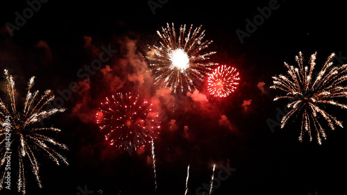 Amazing real beautiful colorful fireworks background on celebration night event for happy new year party, Abstract Multi color golden firework in the night sky