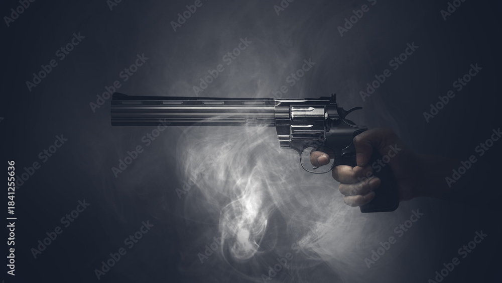 Naklejka premium Hand holding a revolver in a dark, smoky atmosphere. The image evokes a sense of suspense and danger. Concept of Gun Violence