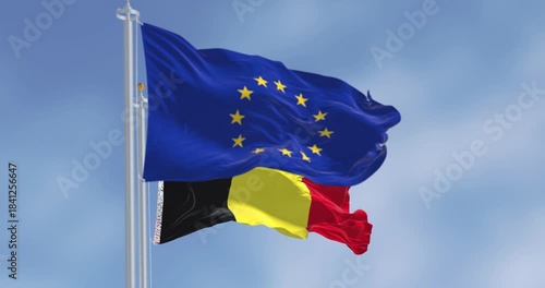 Belgium national flag and European Union flag waving in the wind