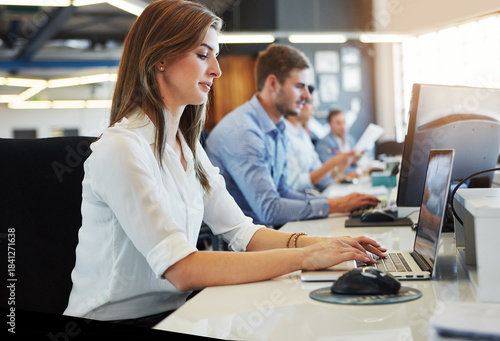 Foto Business, woman and typing with laptop in office for research, data entry and insurance report