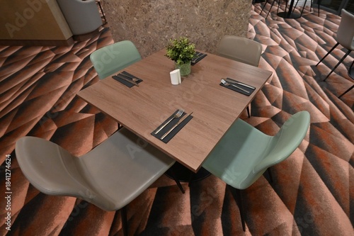 Breakfast place setting on a table in a breakfast room. 