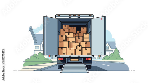 A large truck loaded with numerous cardboard boxes driving down a suburban street with houses and greenery