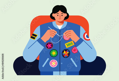 Person with needle sewing on a vibrant jacket adorned with colorful patches