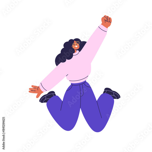 Happy excited girl jumping up with arm, fist raised. Joyful young woman smili...
