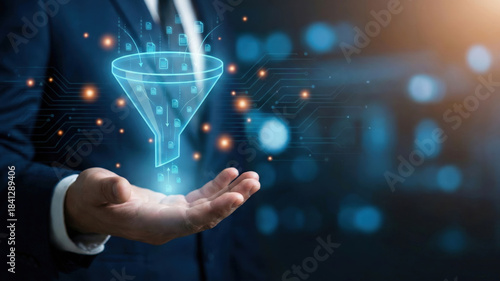 Data filter concept with businessman holding digital funnel hologram, technology innovation for information processing and analysis