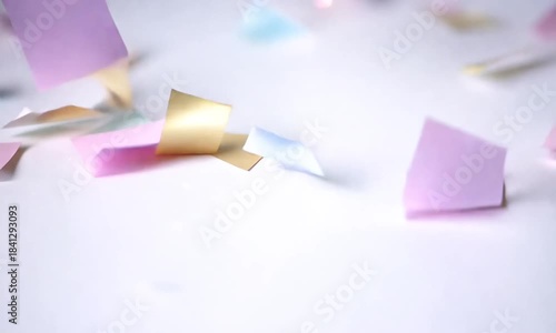 Colorful Paper Squares Dance Gracefully on a Soft White Surface in a Whimsical Display of Creativity and Joy Generative AI