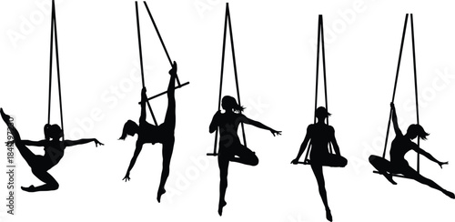 Five female aerial silks performers silhouettes hanging from ropes in various dynamic poses