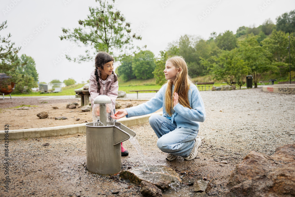 custom made wallpaper toronto digitalSisters washing hands from fountain at park