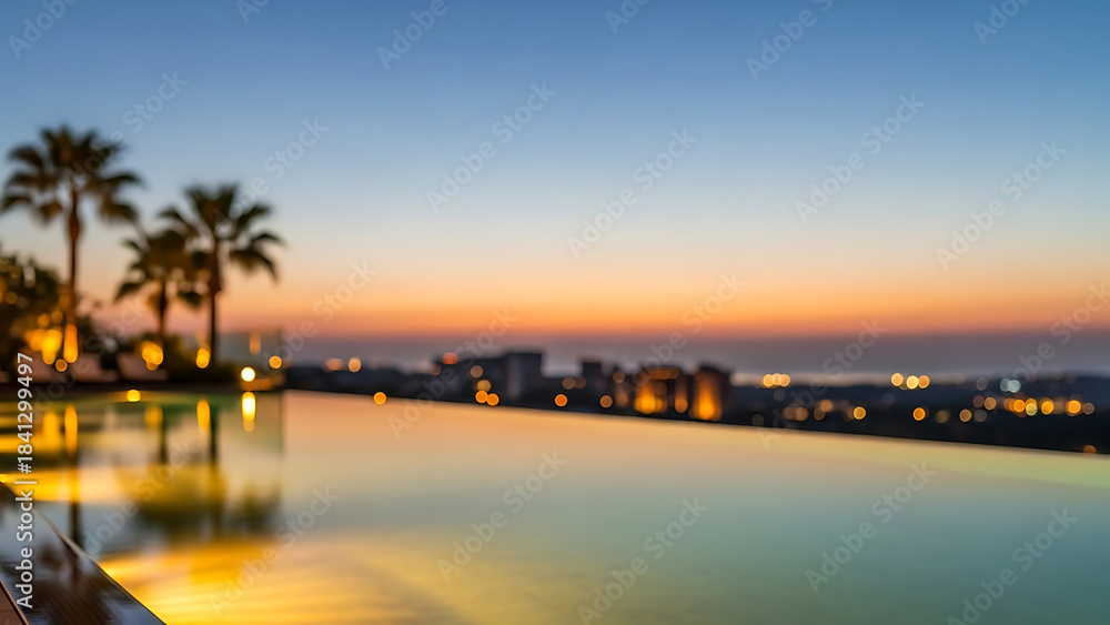 Fototapeta premium Luxurious infinity pool overlooking the ocean at dusk with palm trees silhouetted against a vibrant sunset sky