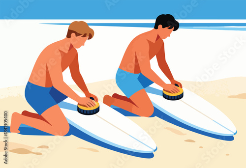 Two young men wax surfboards on a sandy beach with blue sky and ocean