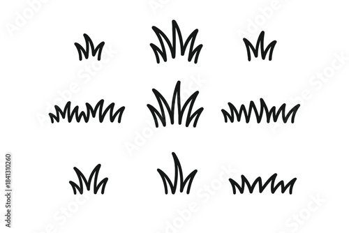 Set of nine hand-drawn style grass clumps and tufts isolated on white