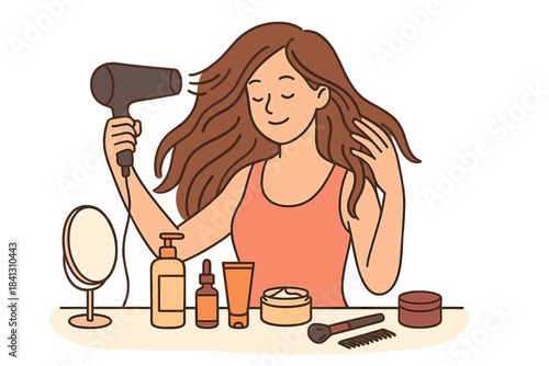 Smiling young woman drying long hair with blow dryer surrounded by cosmetic products