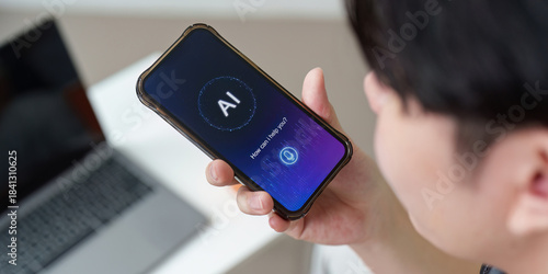 AI Interaction. Young man using smartphone with AI assistant.