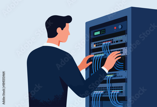 Man in suit connecting cables to a server rack
