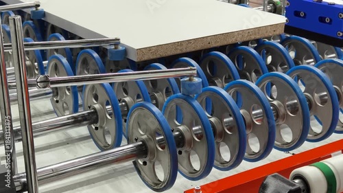 Woodworking machinery in operation demonstrating wheels processing materials