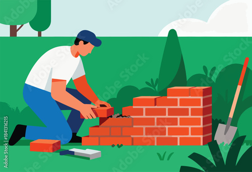 Person building a brick wall in a garden with a shovel