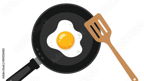 A fried egg cooking in a black pan with a wooden spatula on a white background