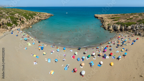 Fototapeta Naklejka Na Ścianę i Meble -  Aerial panoramic view of Cala Mosche (or Calamosche) beach, a beautiful sandy beach within the Vendicari Nature Reserve, near Noto, Sicily, Italy. It's famous for its crystal clear and blue waters.