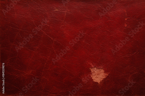 Distressed red leather texture with worn patch – vintage cracked leather background for retro book cover mockups, game assets, or restoration design